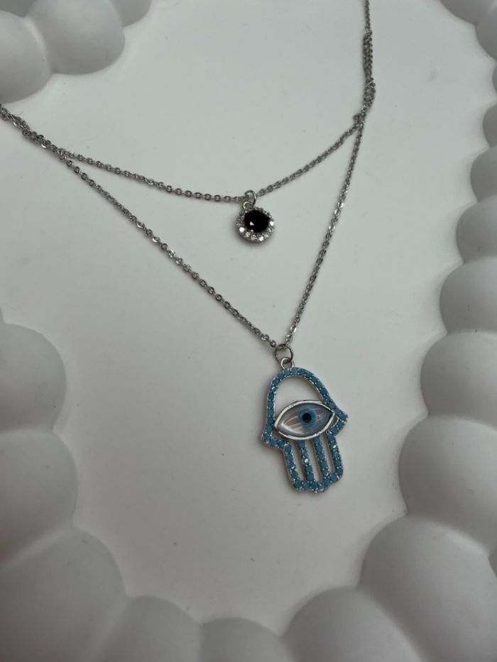 нүдтэй зүүлт