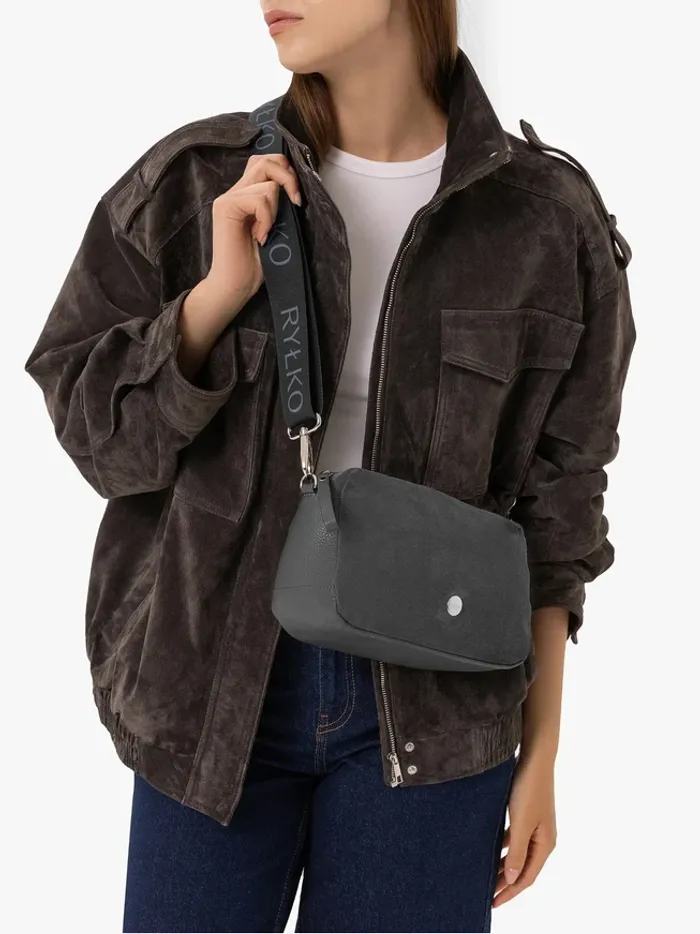 A dark gray handbag with a wide strap