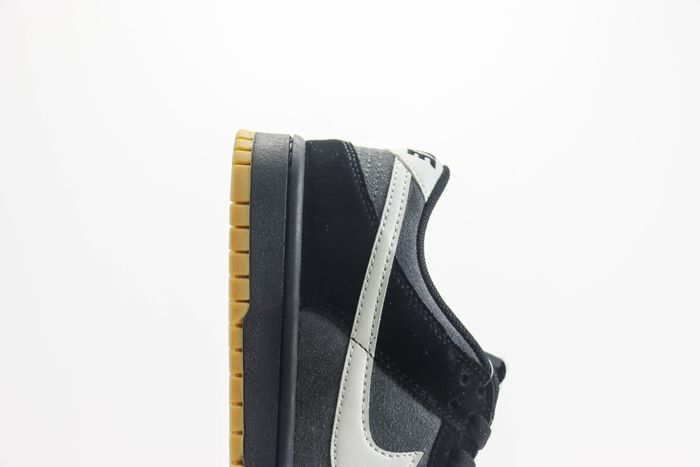The Nike Dunk Low Surfaces in Black, Grey, and Gum