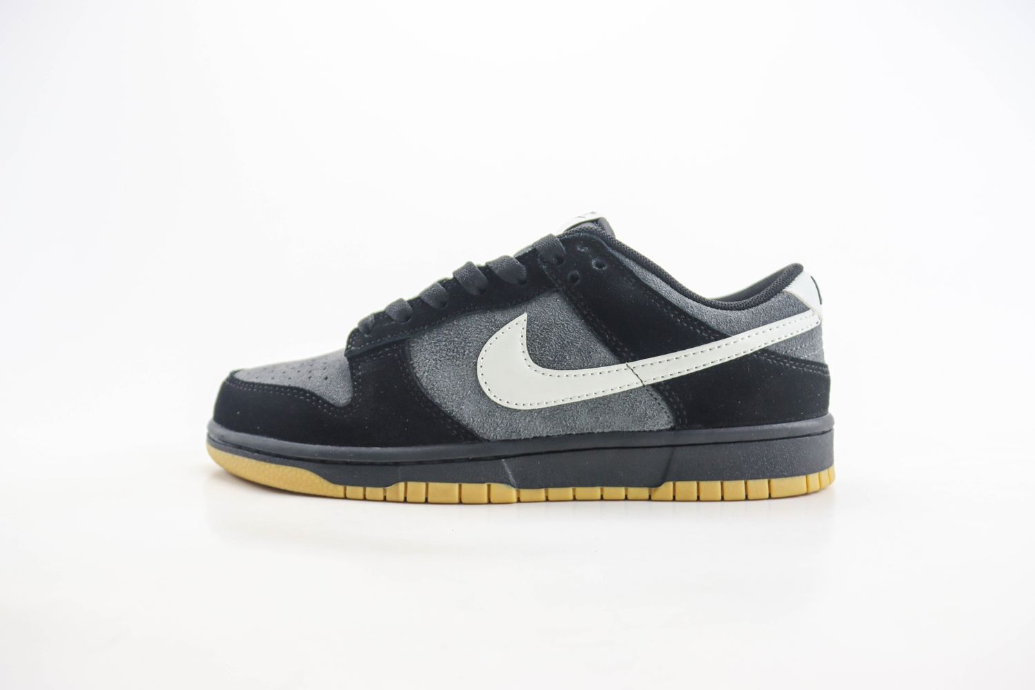 The Nike Dunk Low Surfaces in Black, Grey, and Gum