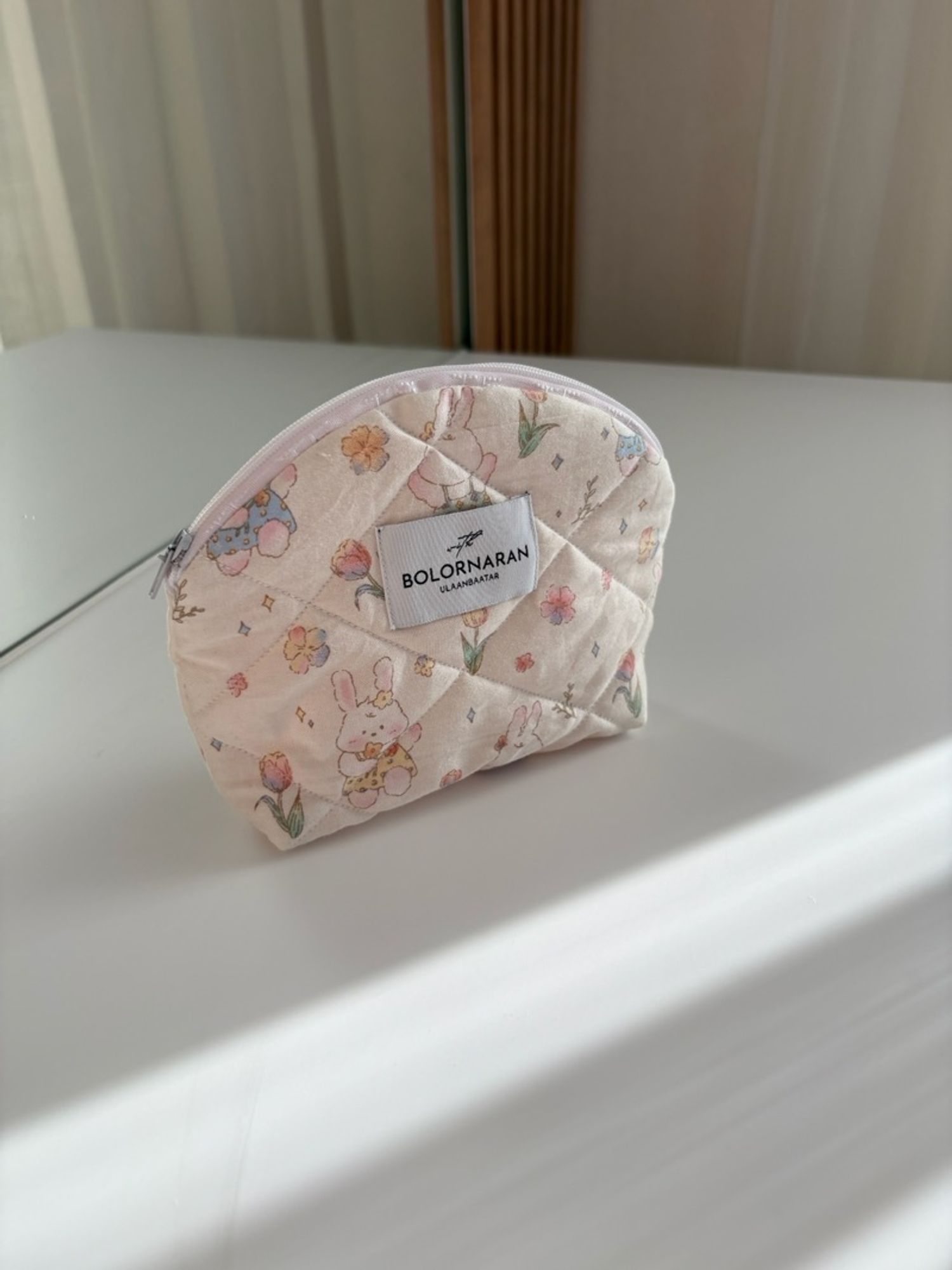 Oval pouch with bunny